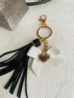 Guess Gold Heart Charm Keychain with Black Tassel and White Bow